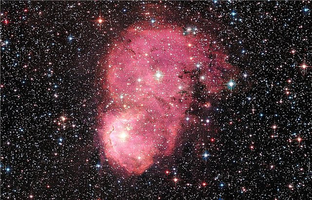 Hubble Spots festlig nebula i angränsande galax